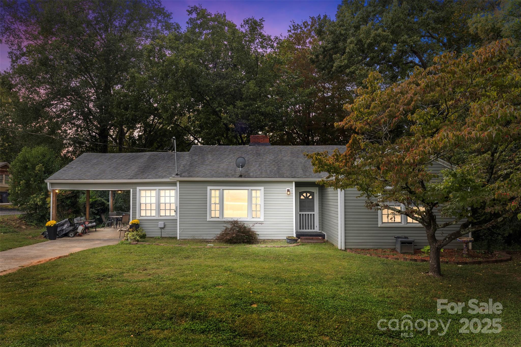 310 South Main Street Stanley, NC 28164 - Photo 1 of 22 a front view of a house with a garden