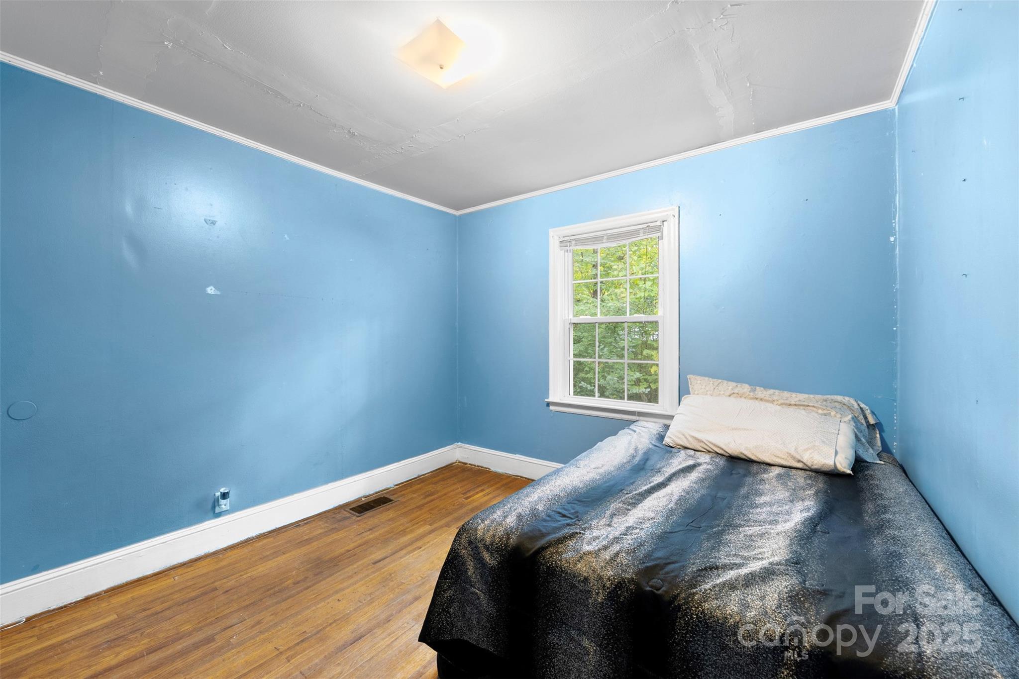 310 South Main Street Stanley, NC 28164 - Photo 15 of 22 a bedroom with a bed and a window