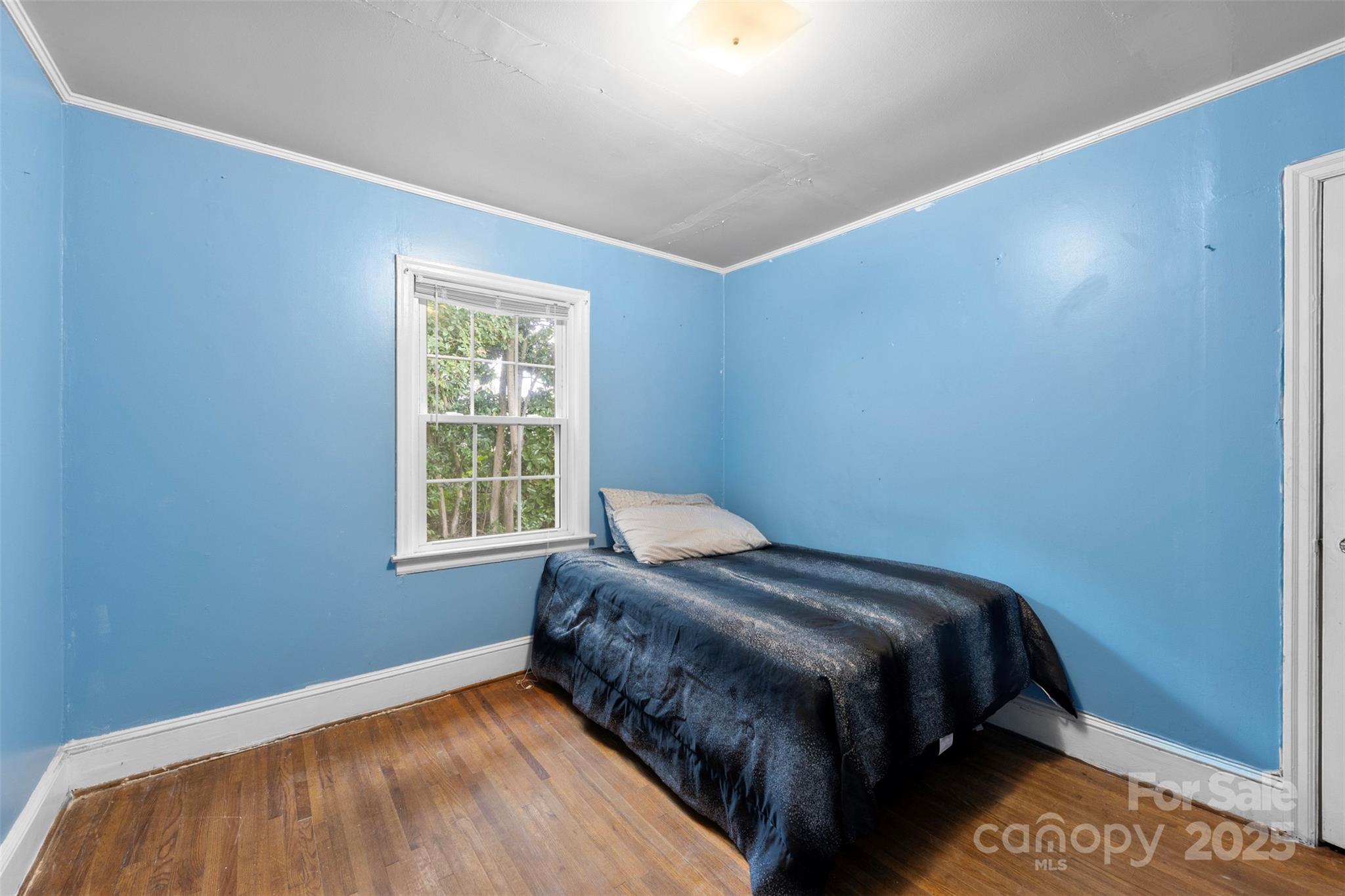 310 South Main Street Stanley, NC 28164 - Photo 16 of 22 a bedroom with a bed and window