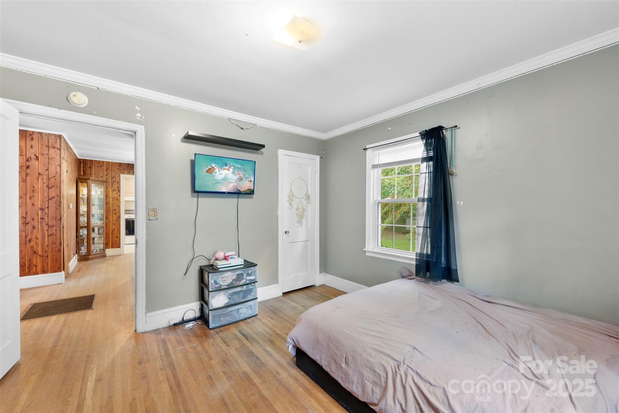310 South Main Street Stanley, NC 28164 - Photo 18 of 22 a bedroom with a bed and a window