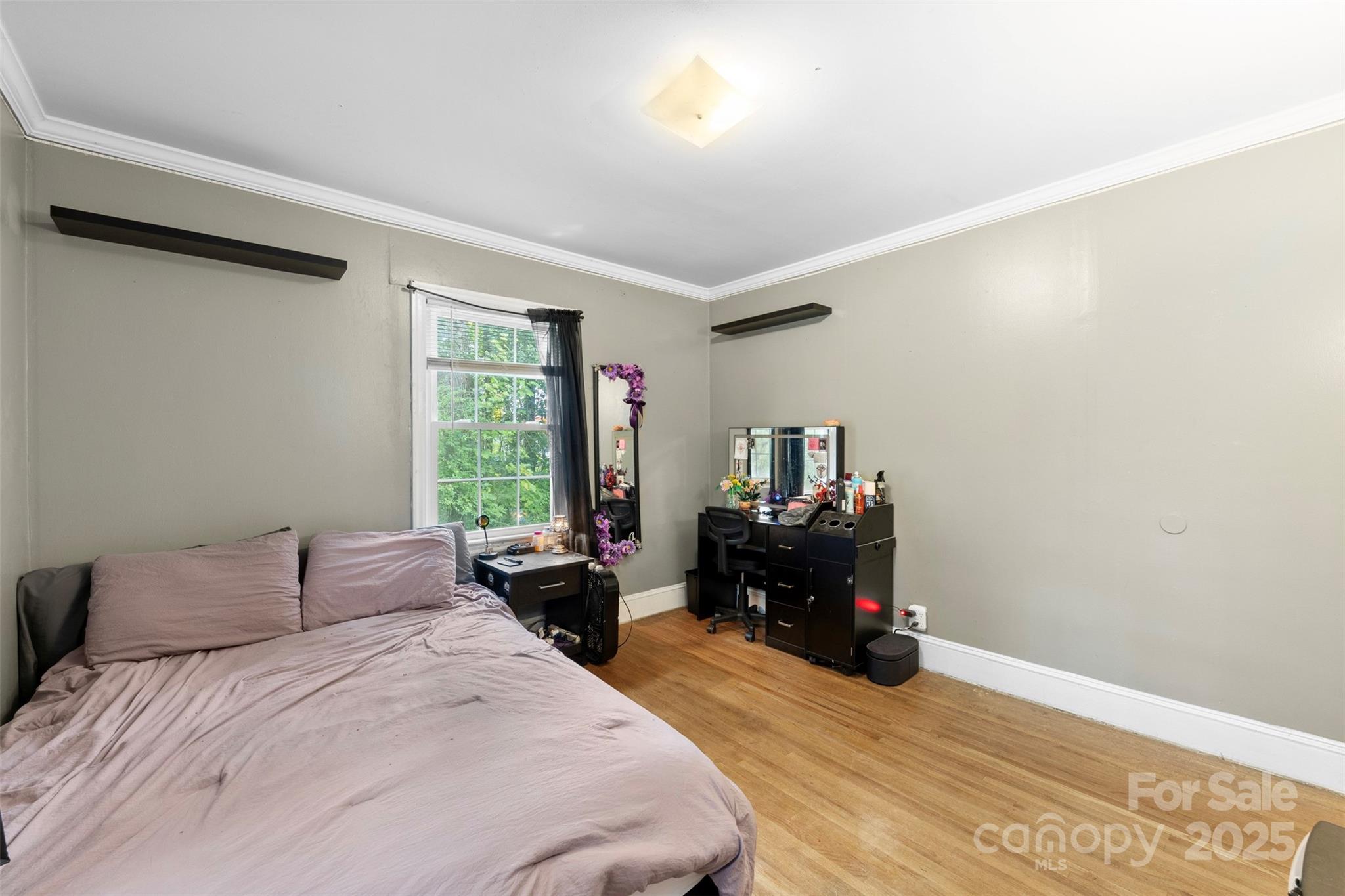 310 South Main Street Stanley, NC 28164 - Photo 19 of 22 a bedroom with a bed and a large window