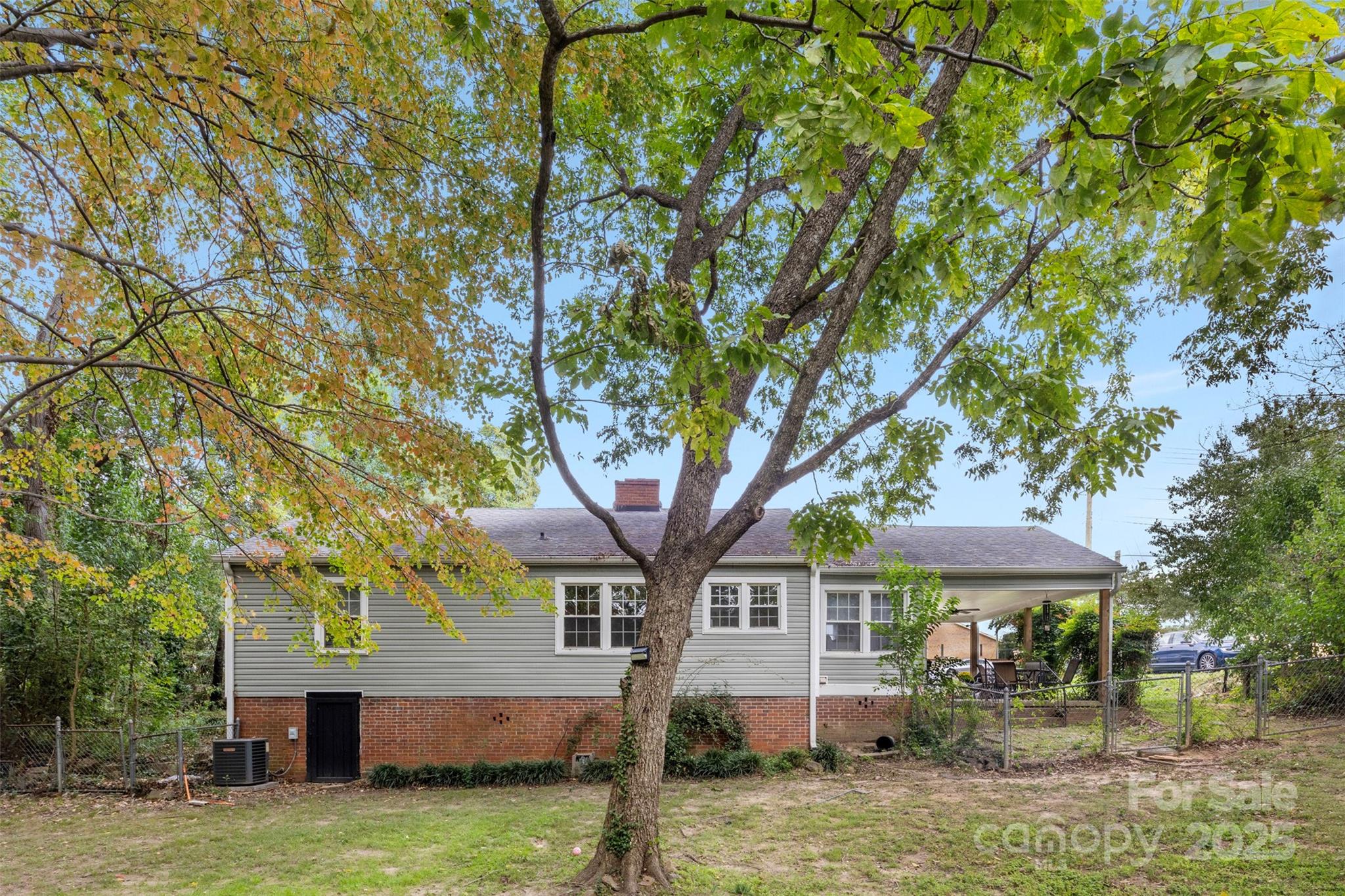 310 South Main Street Stanley, NC 28164 - Photo 21 of 22 a front view of a house with garden and trees