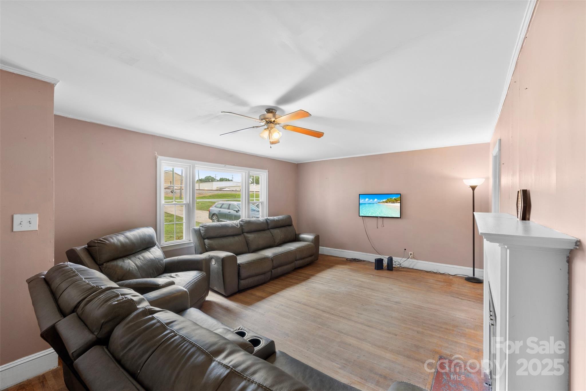 310 South Main Street Stanley, NC 28164 - Photo 6 of 22 a living room with furniture and a flat screen tv