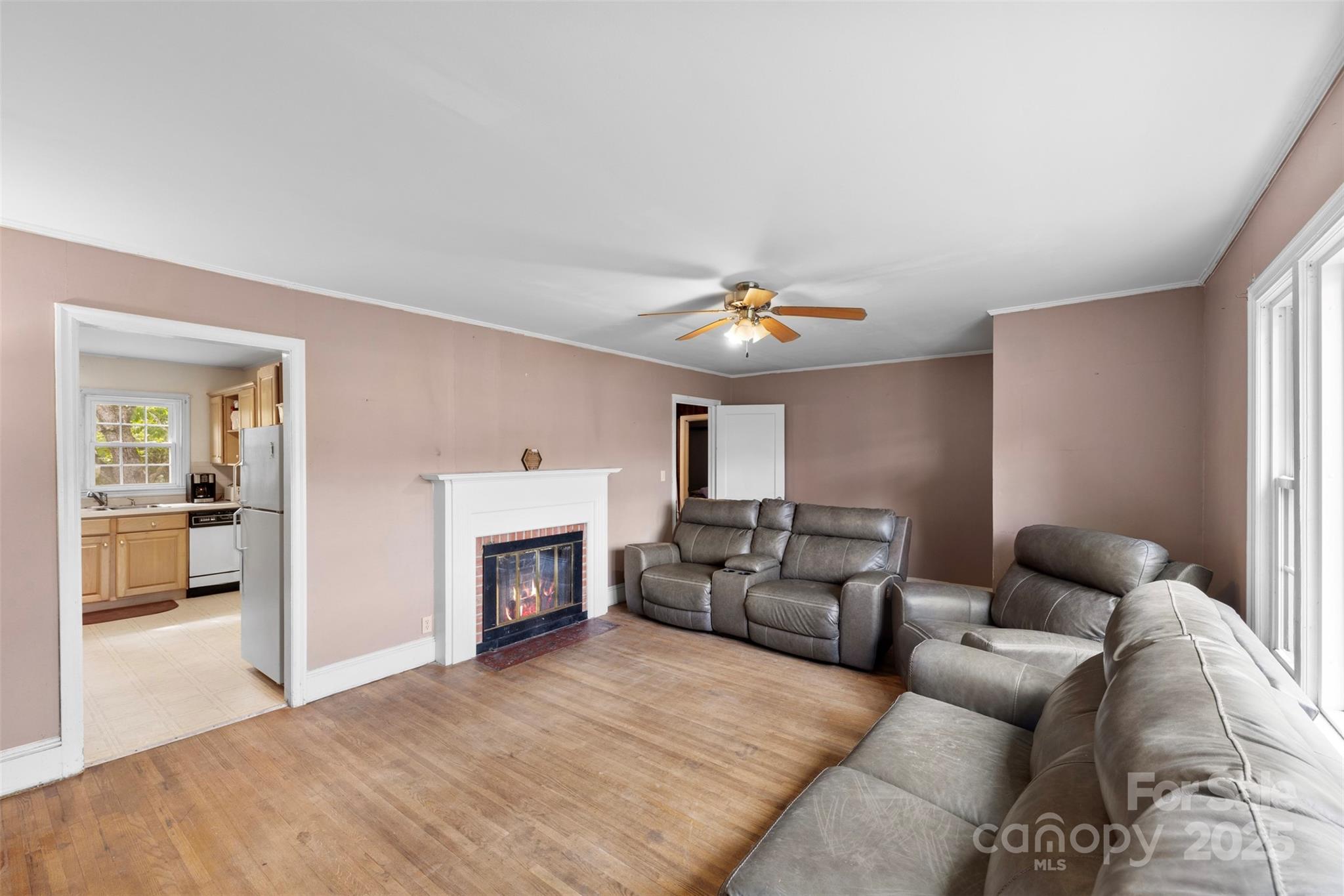 310 South Main Street Stanley, NC 28164 - Photo 7 of 22 a living room with furniture and a fireplace