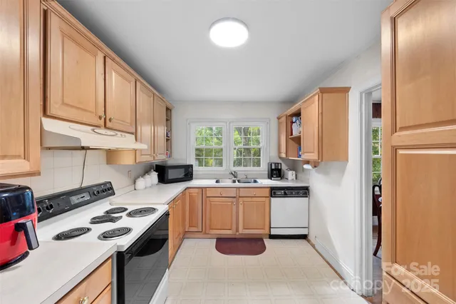 a kitchen with a sink stove and refrigerator
