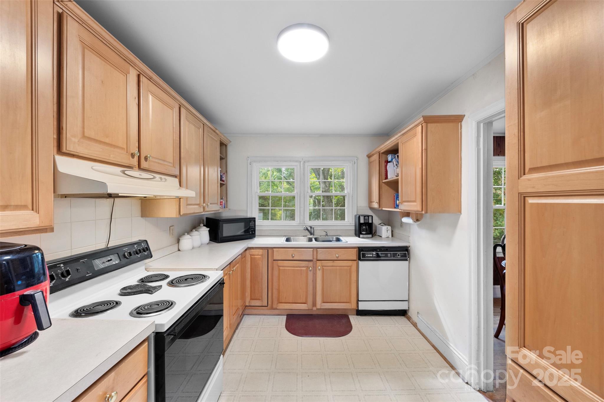 310 South Main Street Stanley, NC 28164 - Photo 9 of 22 a kitchen with a sink stove and refrigerator