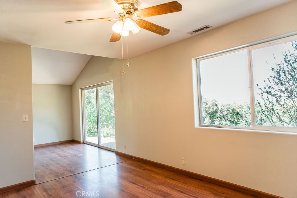 5085 Boyer Road Mariposa, CA 95338 - Photo 19 of 75 a view of an empty room with a window and wooden floor