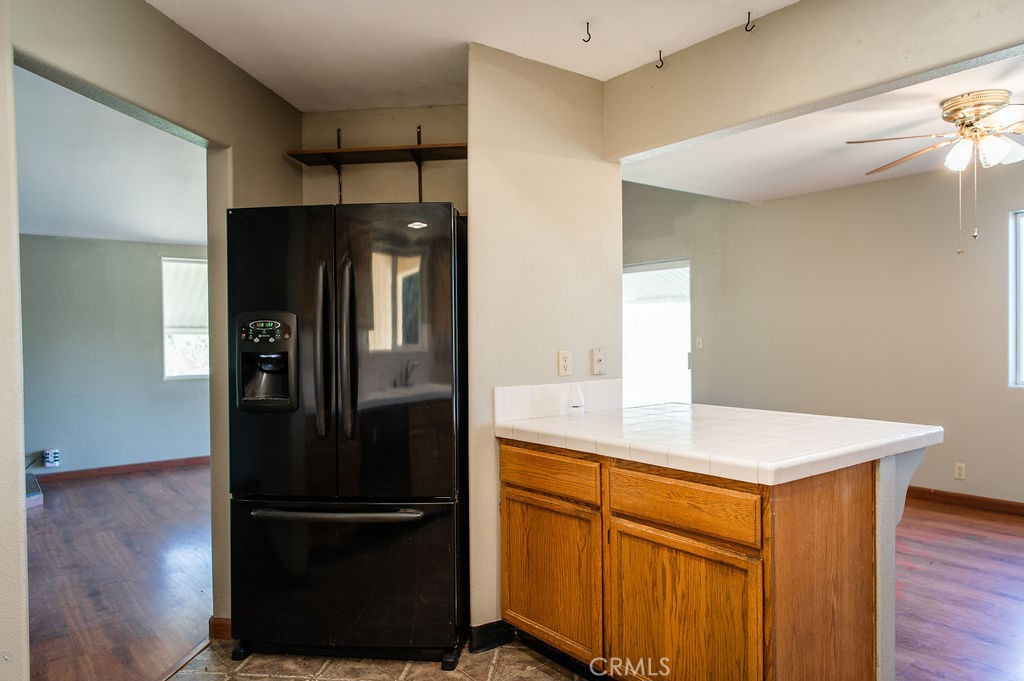 5085 Boyer Road Mariposa, CA 95338 - Photo 25 of 75 a kitchen with a refrigerator and a sink