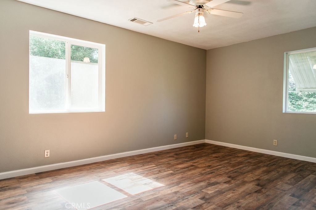 5085 Boyer Road Mariposa, CA 95338 - Photo 37 of 75 a view of an empty room with wooden floor and a window