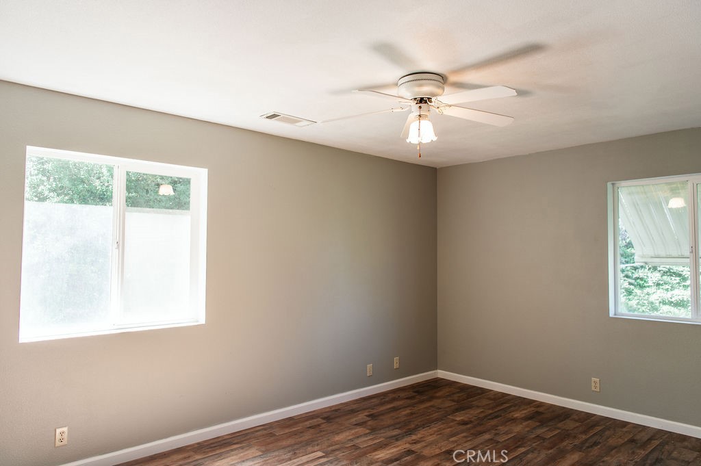 5085 Boyer Road Mariposa, CA 95338 - Photo 38 of 75 a view of an empty room with window and wooden floor