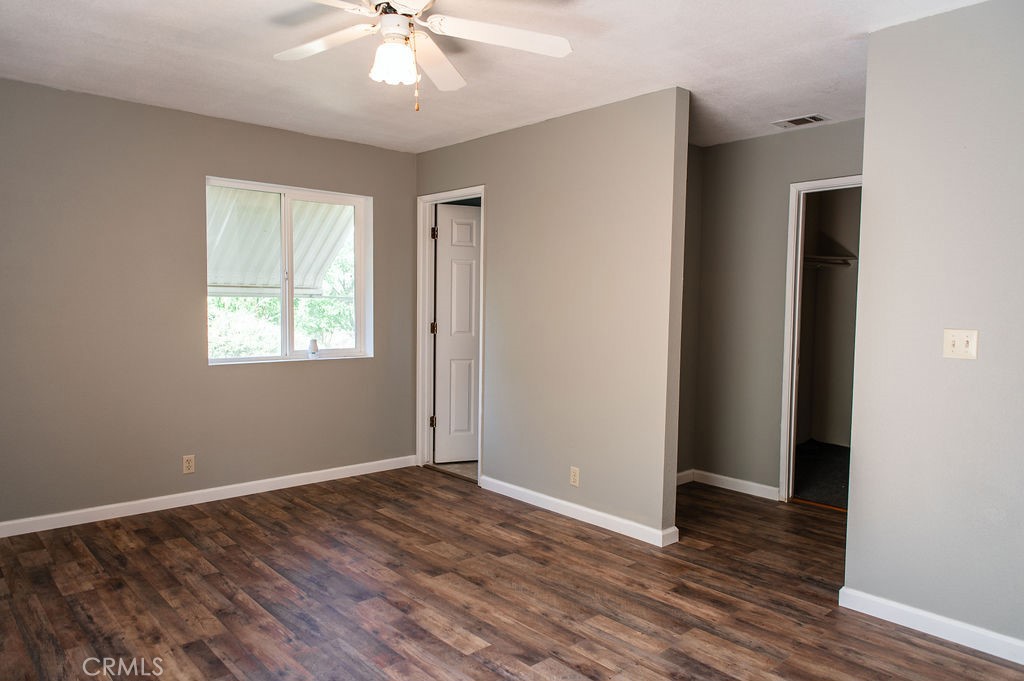 5085 Boyer Road Mariposa, CA 95338 - Photo 40 of 75 a view of an empty room with wooden floor and a window