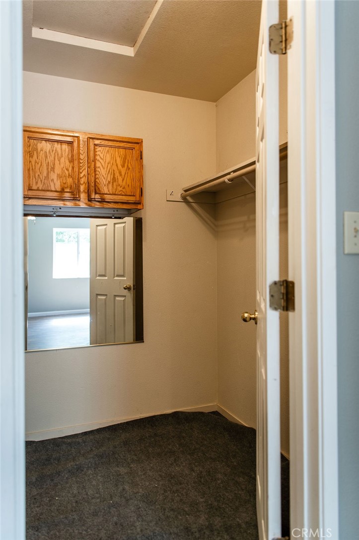 5085 Boyer Road Mariposa, CA 95338 - Photo 42 of 75 a view of an empty room with wooden floor and a window