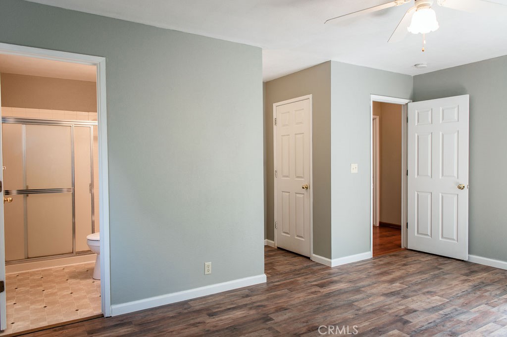 5085 Boyer Road Mariposa, CA 95338 - Photo 47 of 75 an empty room with wooden floor and closet area