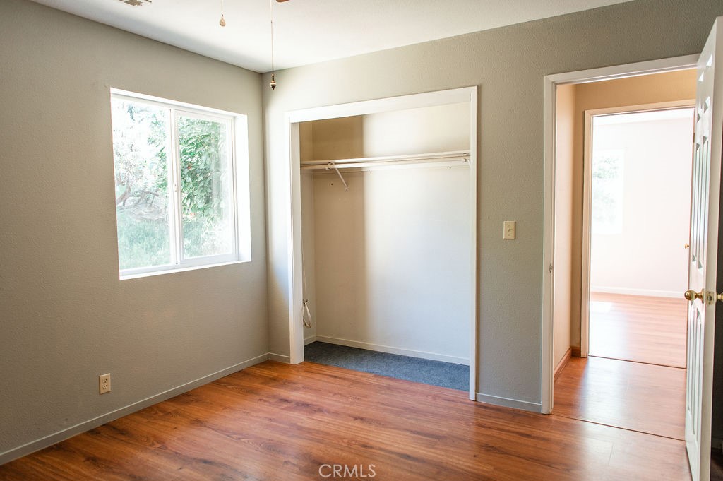 5085 Boyer Road Mariposa, CA 95338 - Photo 57 of 75 a view of an empty room with wooden floor and a window