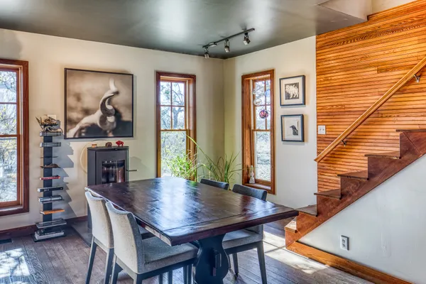 a view of a dining room with furniture window and wooden floor