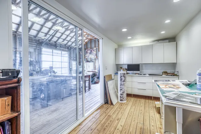 a view of yard covered with snow in front of house