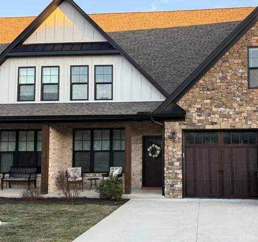 a front view of house with outdoor seating