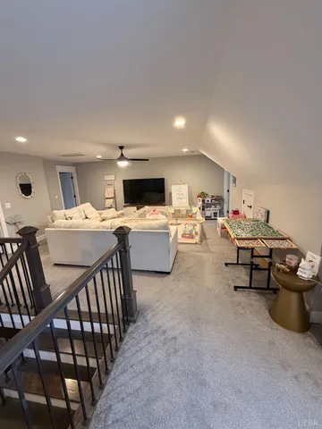 a bedroom with a bed and a large window with outer view