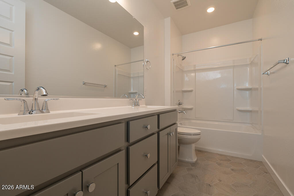 5857 South Granite Street Gilbert, AZ 85298 - Photo 14 of 20 a bathroom with a double vanity sink toilet and shower