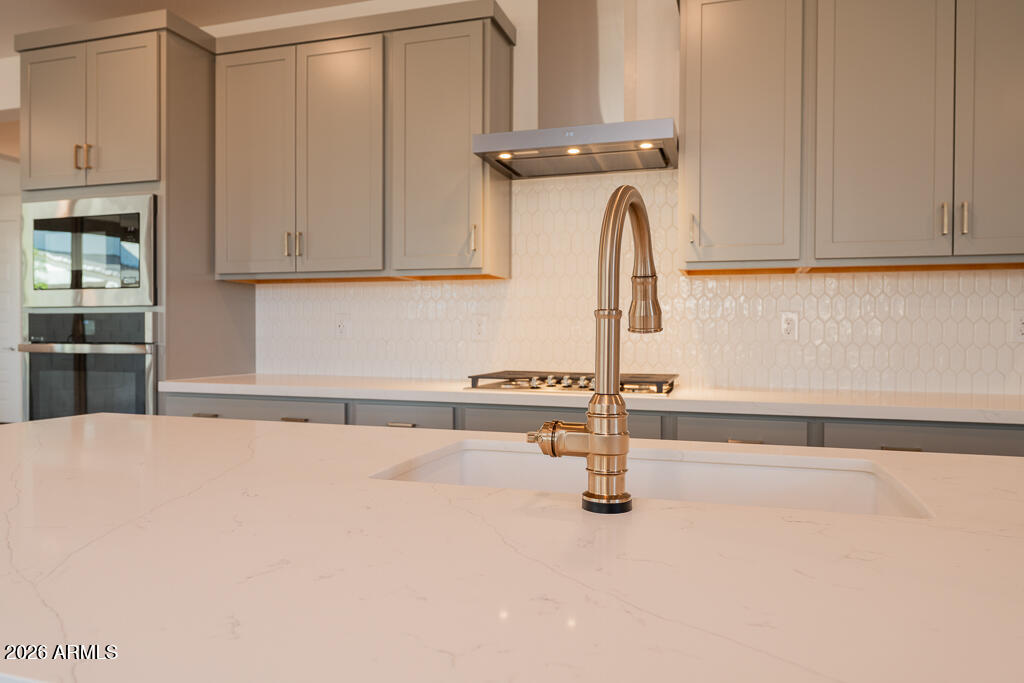 5857 South Granite Street Gilbert, AZ 85298 - Photo 3 of 20 a kitchen with a sink and cabinets