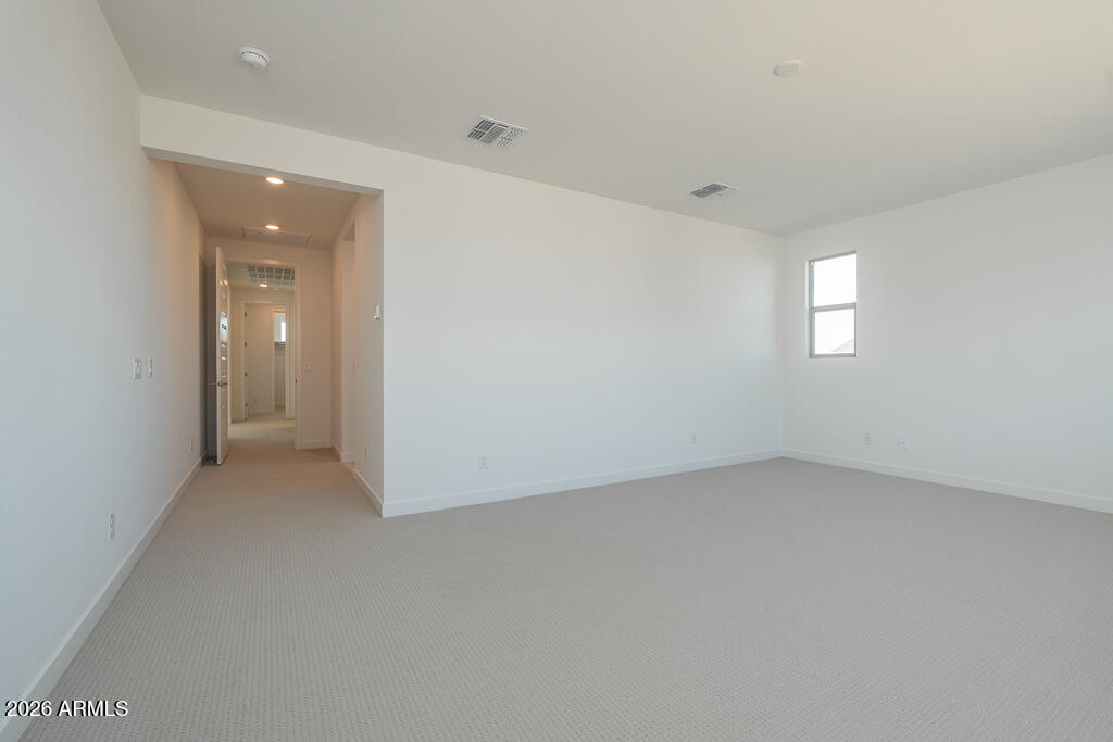 5857 South Granite Street Gilbert, AZ 85298 - Photo 7 of 20 an empty room with a bathroom and windows