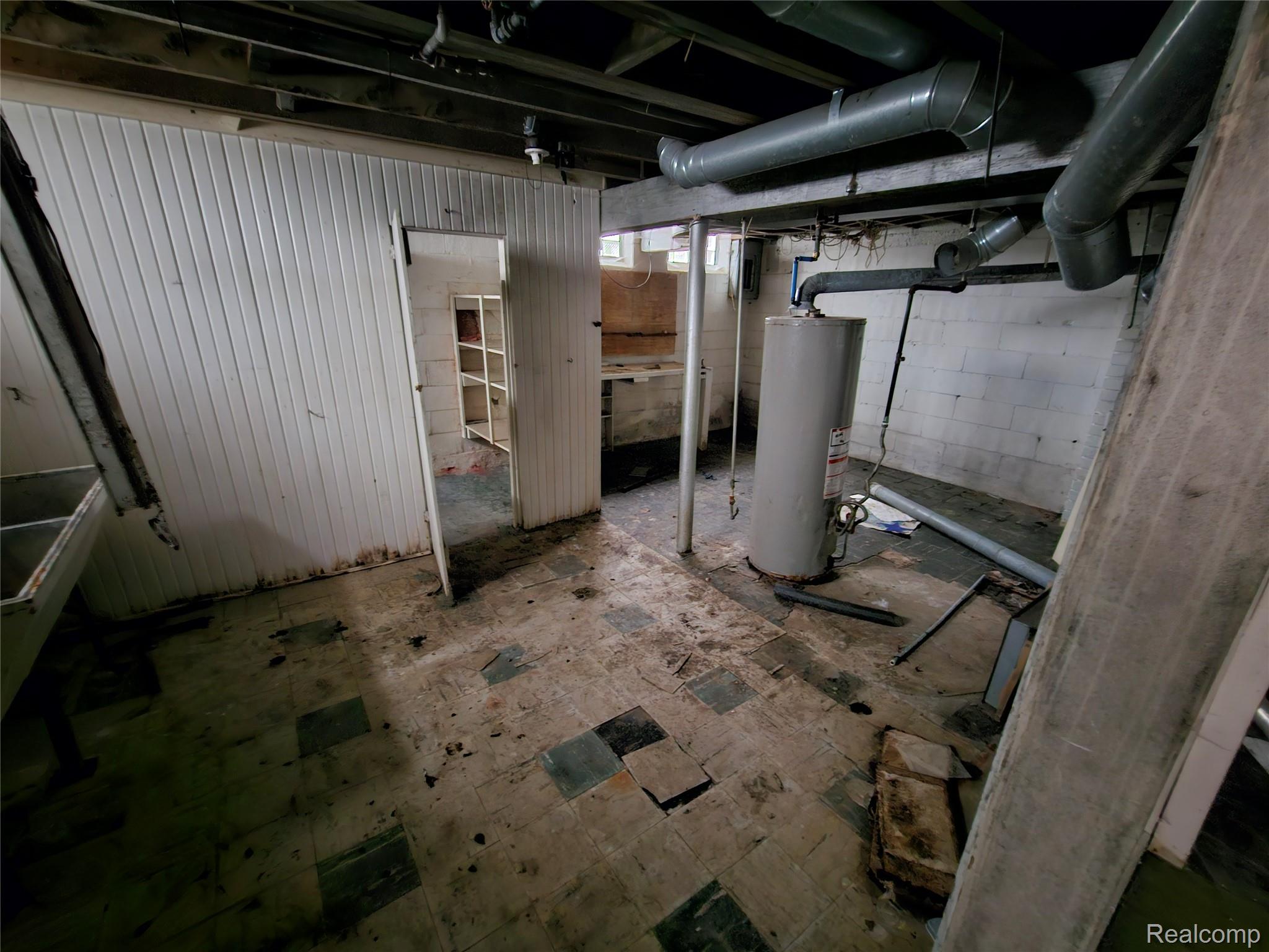 19442 Moross Road Detroit, MI 48224 - Photo 43 of 48 Unfinished basement with gas water heater and electric panel
