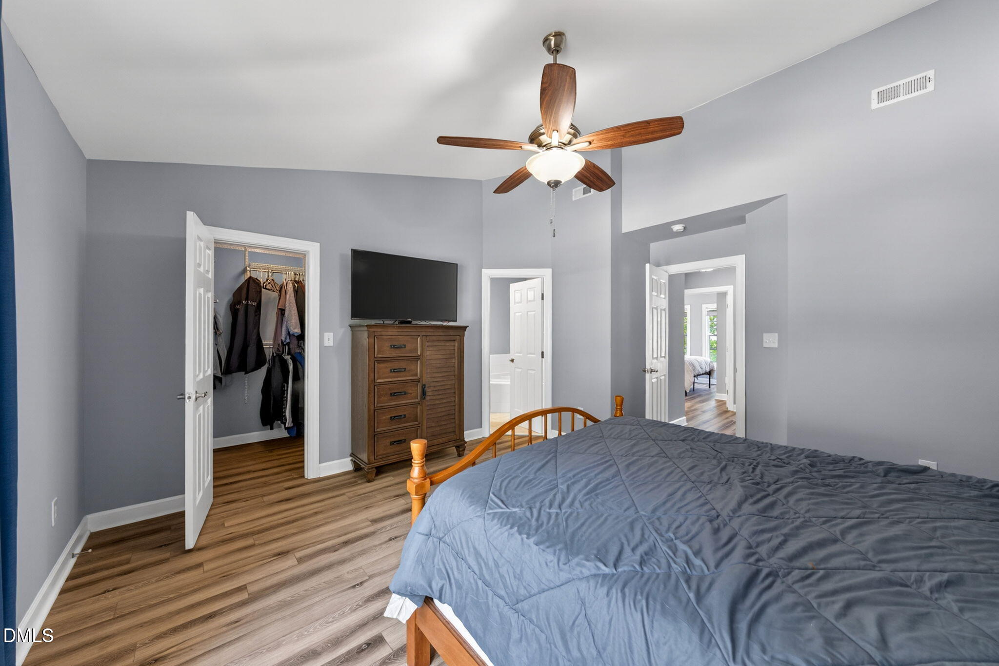 5500 Vista View Court Raleigh, NC 27612 - Photo 26 of 38 a bedroom with a bed and a ceiling fan