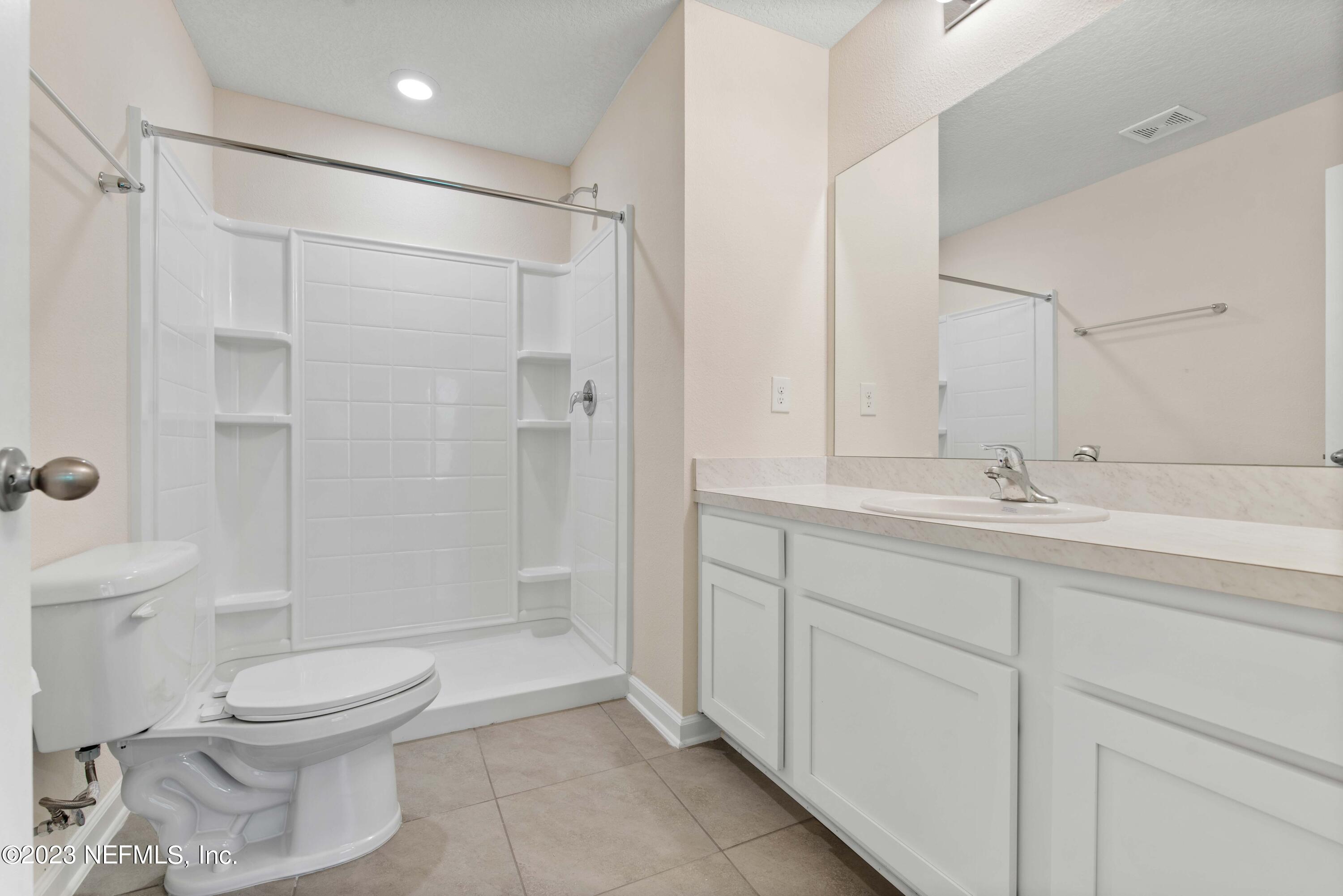 920 Rotary Road Jacksonville, FL 32211 - Photo 12 of 15 a bathroom with a toilet sink and shower