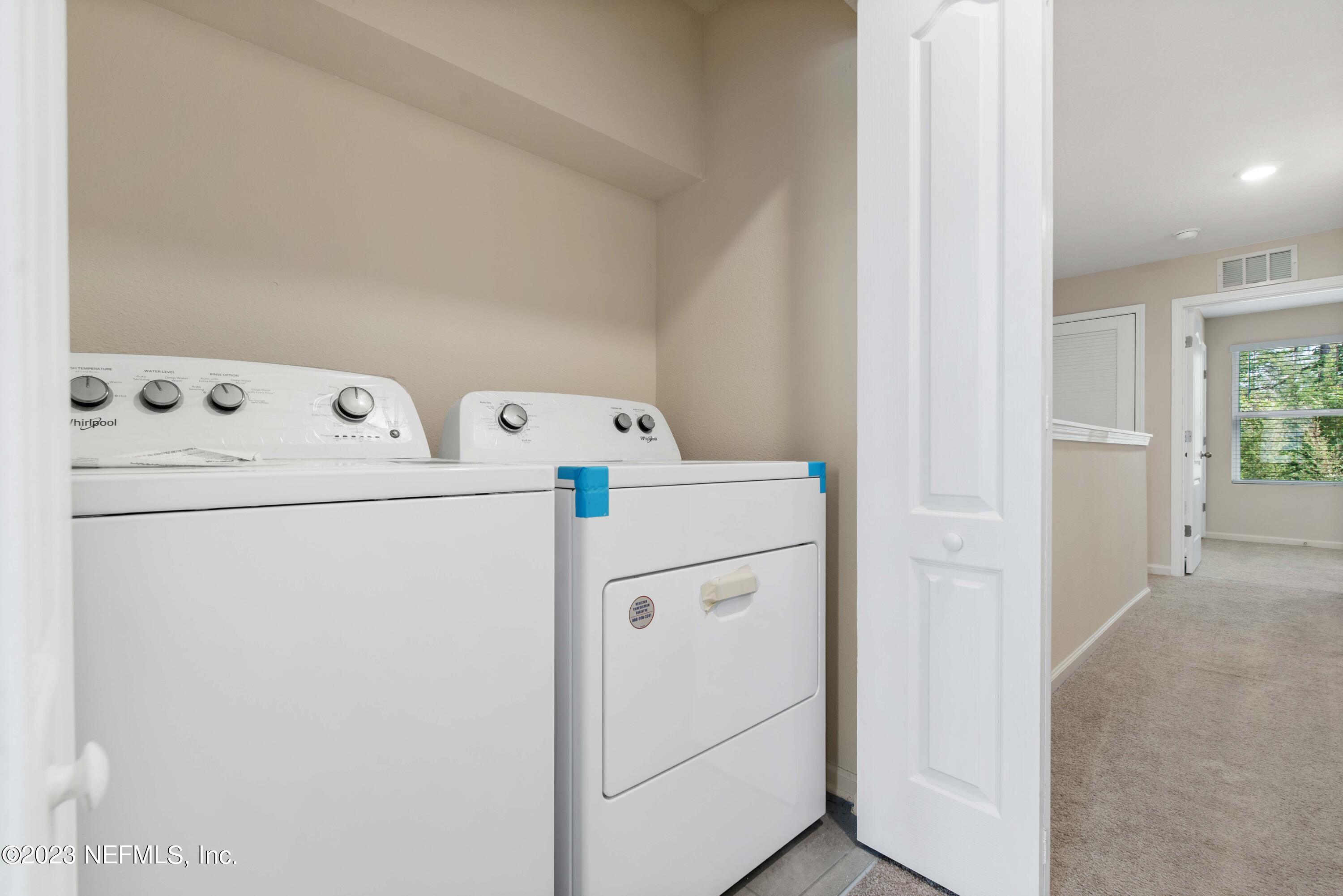 920 Rotary Road Jacksonville, FL 32211 - Photo 13 of 15 a utility room with dryer and washer