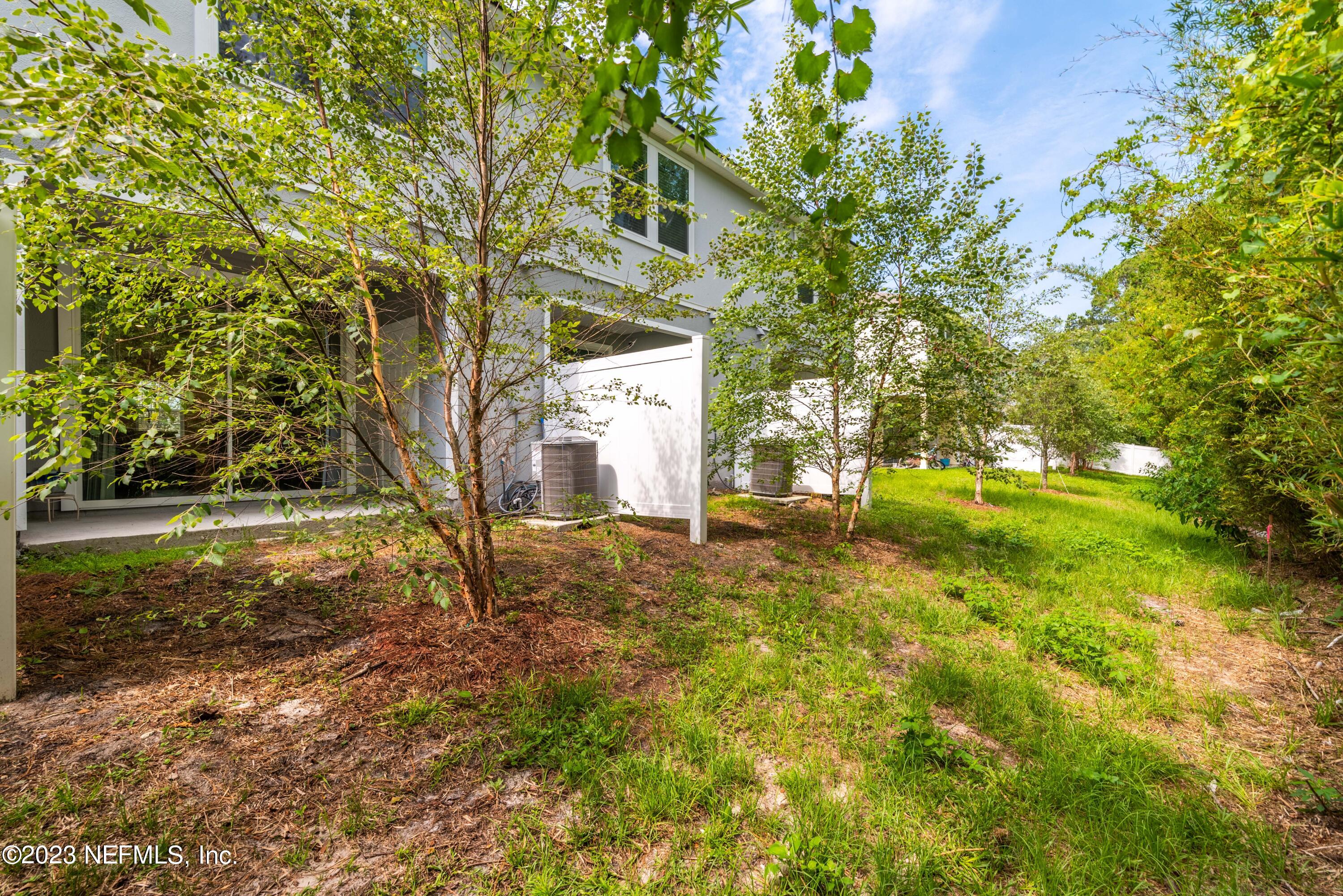 920 Rotary Road Jacksonville, FL 32211 - Photo 15 of 15 a backyard of a house with lots of green space
