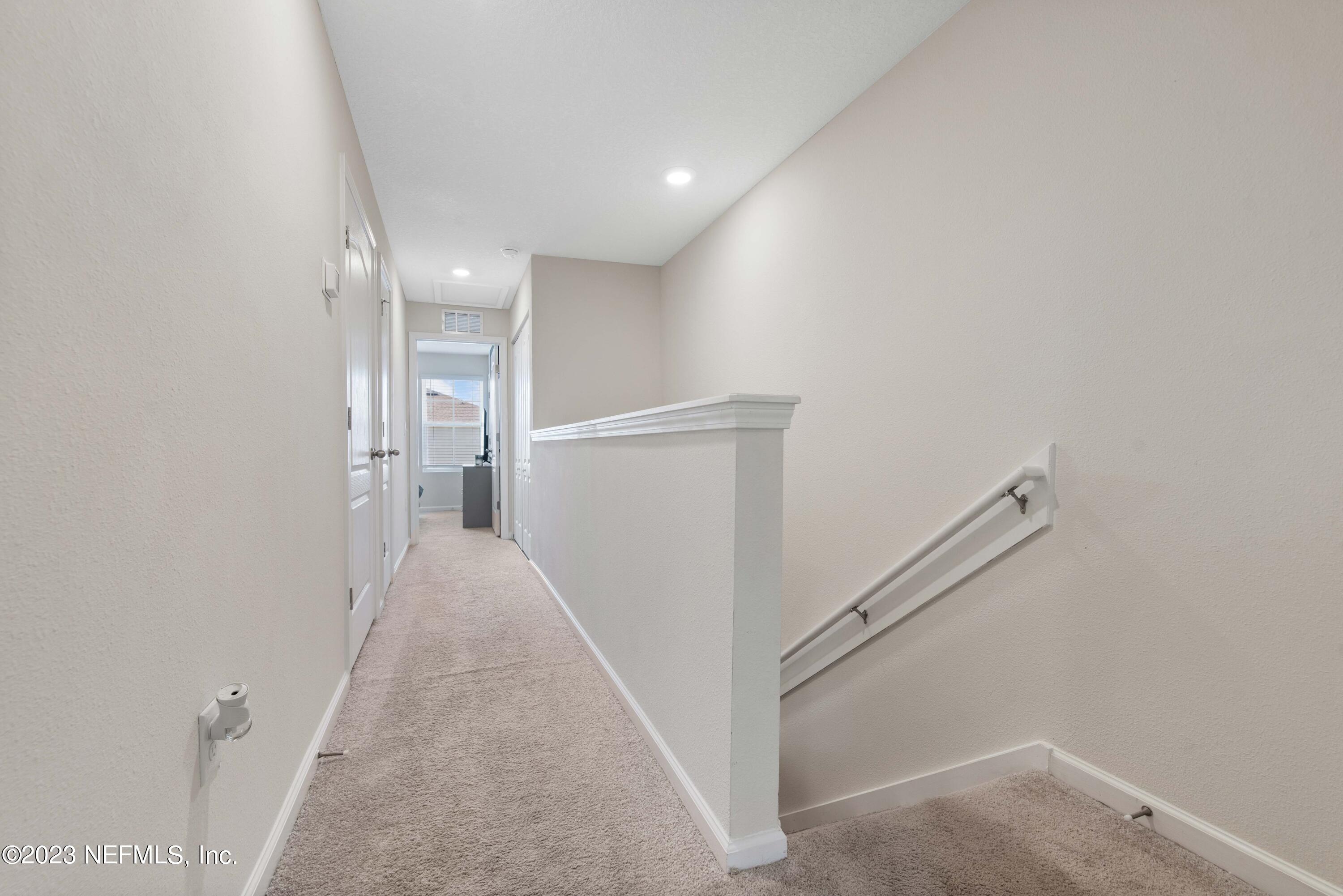 920 Rotary Road Jacksonville, FL 32211 - Photo 7 of 15 a view of a hallway with staircase