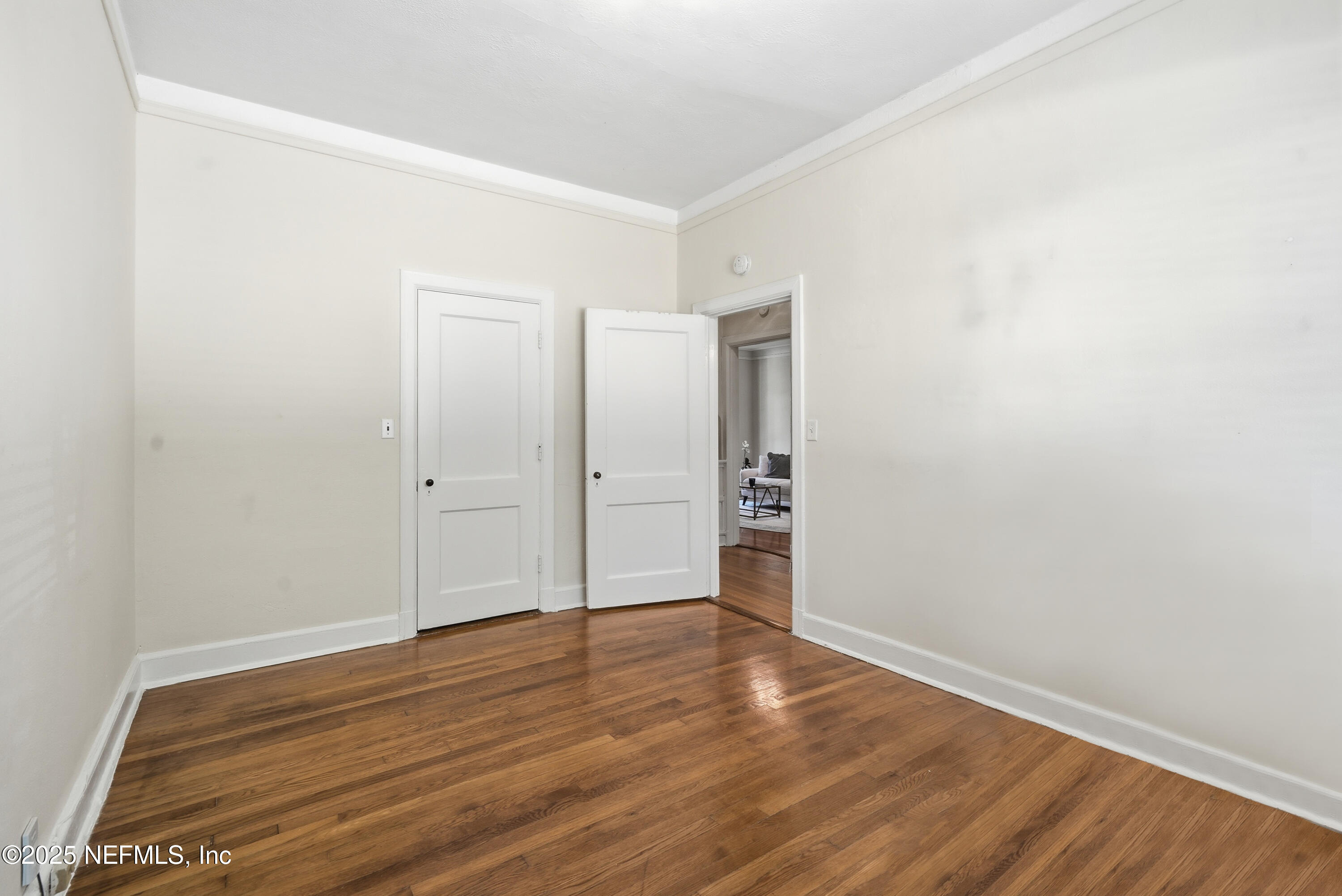 3319 Pine Street, Unit 7 Jacksonville, FL 32205 - Photo 22 of 37 a view of an empty room with wooden floor