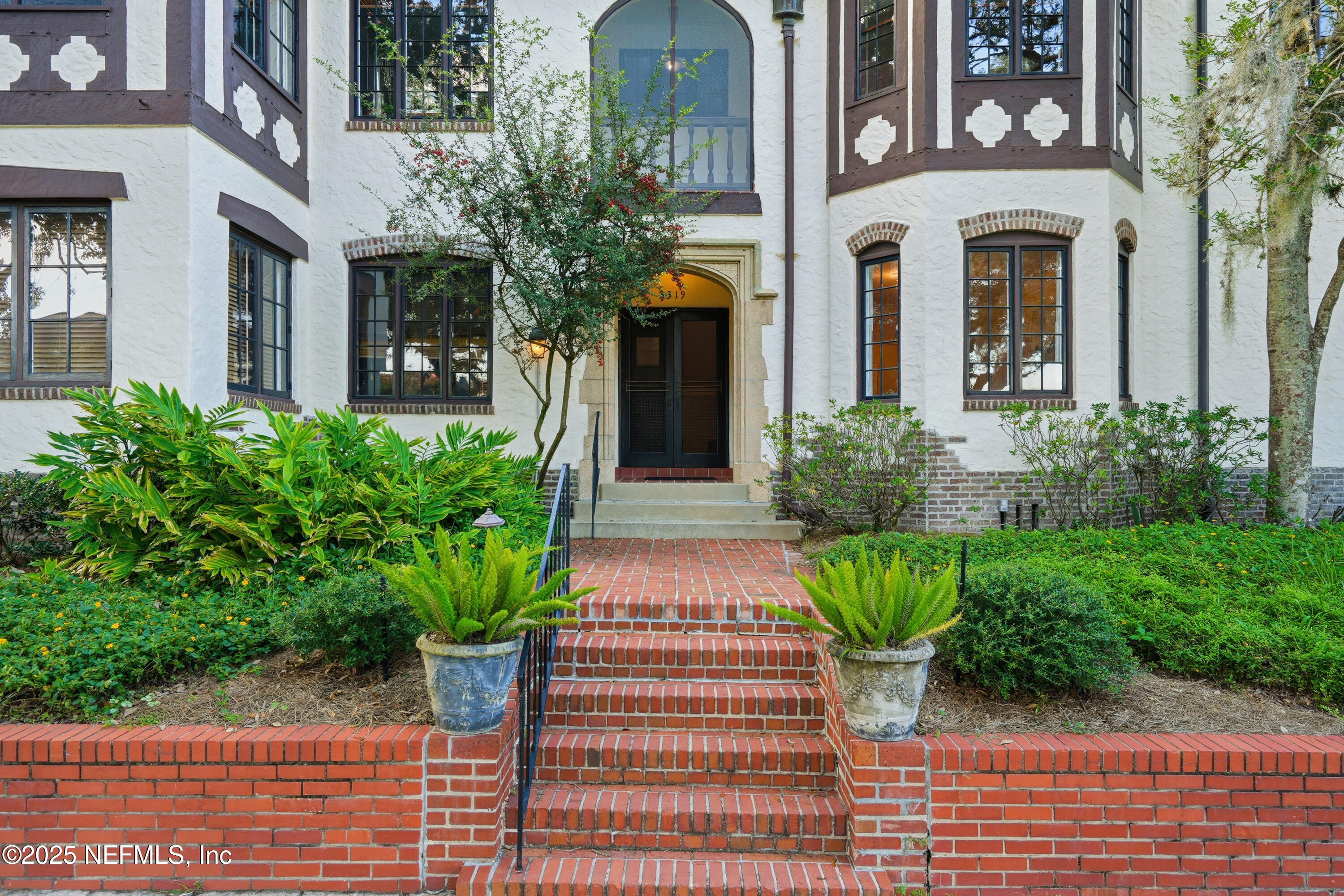 3319 Pine Street, Unit 7 Jacksonville, FL 32205 - Photo 32 of 37 a front view of a house with garden