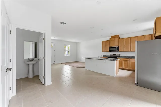 a kitchen that has a sink and a stove