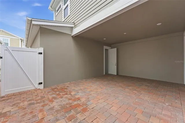 a view of a closet area with an empty room