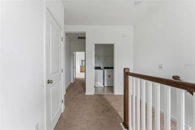 a view of empty room with a fireplace