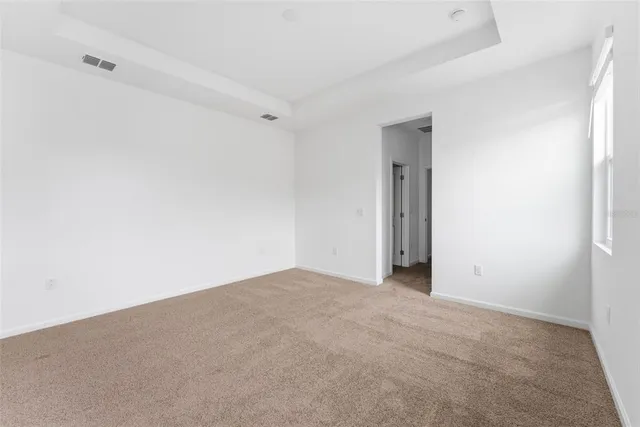 an aerial view of a house with a swimming pool