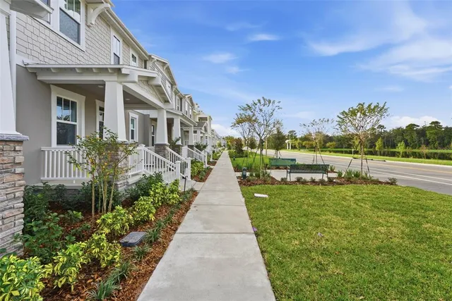 a kitchen with stainless steel appliances granite countertop a stove top oven a sink and dishwasher