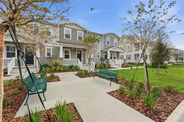 a large kitchen with cabinets and stainless steel appliances