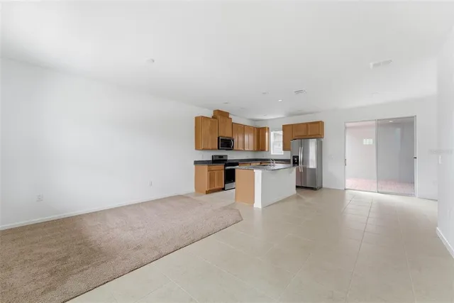 a kitchen with stainless steel appliances granite countertop a sink and cabinets