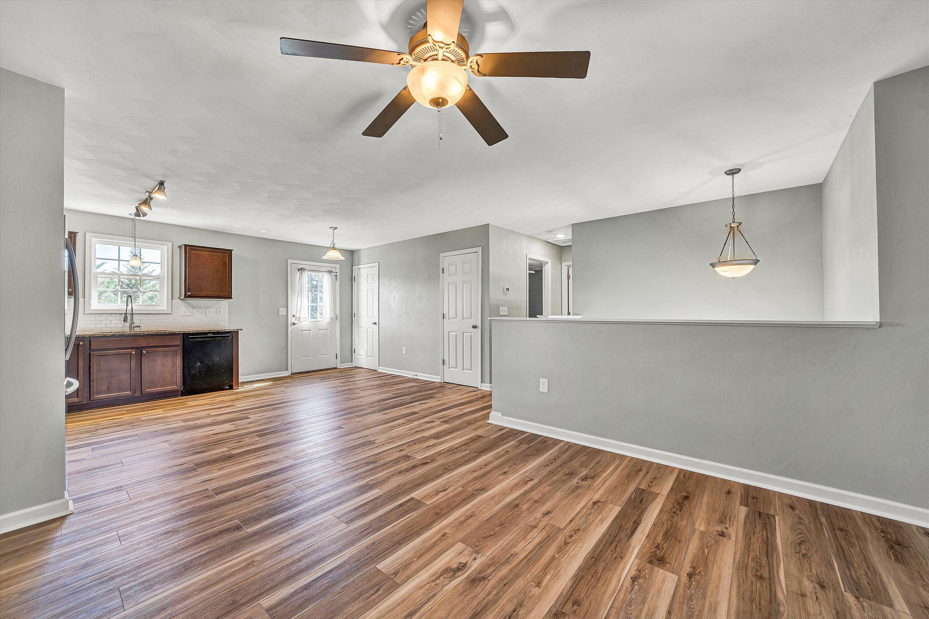 555 Old Fort Road Rocky Mount, VA 24151 - Photo 11 of 35 a view of empty room with wooden floor and fan
