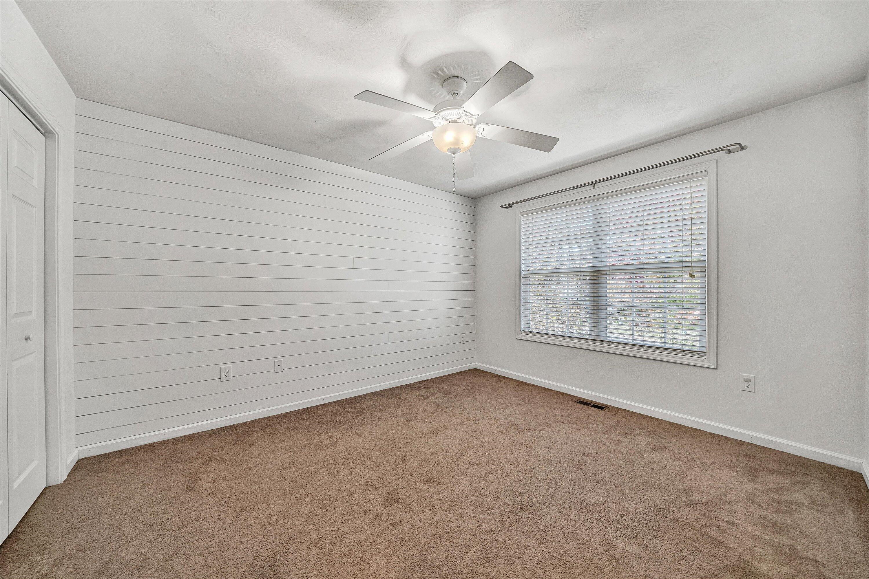 555 Old Fort Road Rocky Mount, VA 24151 - Photo 15 of 35 an empty room with windows and fan