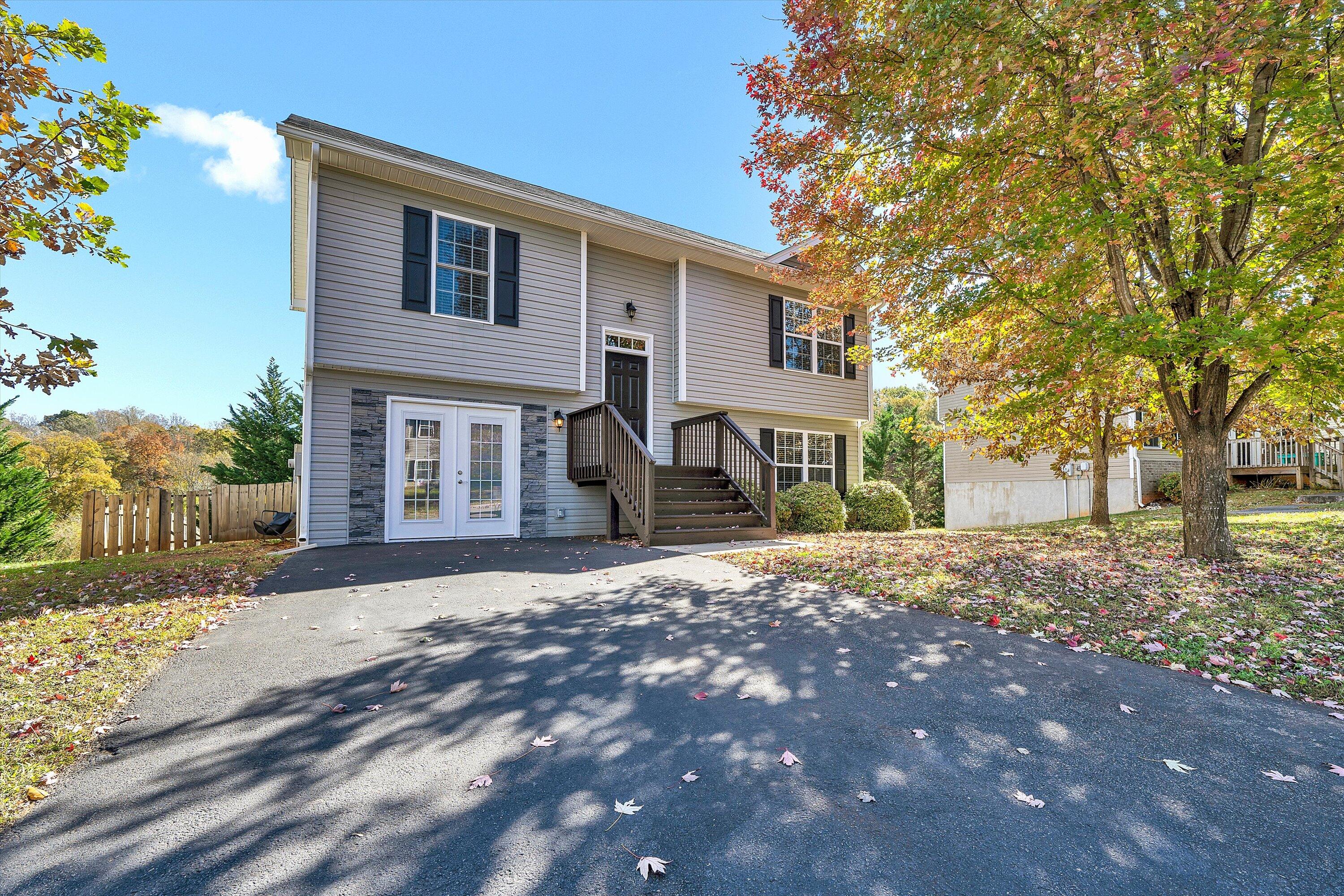 555 Old Fort Road Rocky Mount, VA 24151 - Photo 32 of 35 a front view of a house with a yard and garage