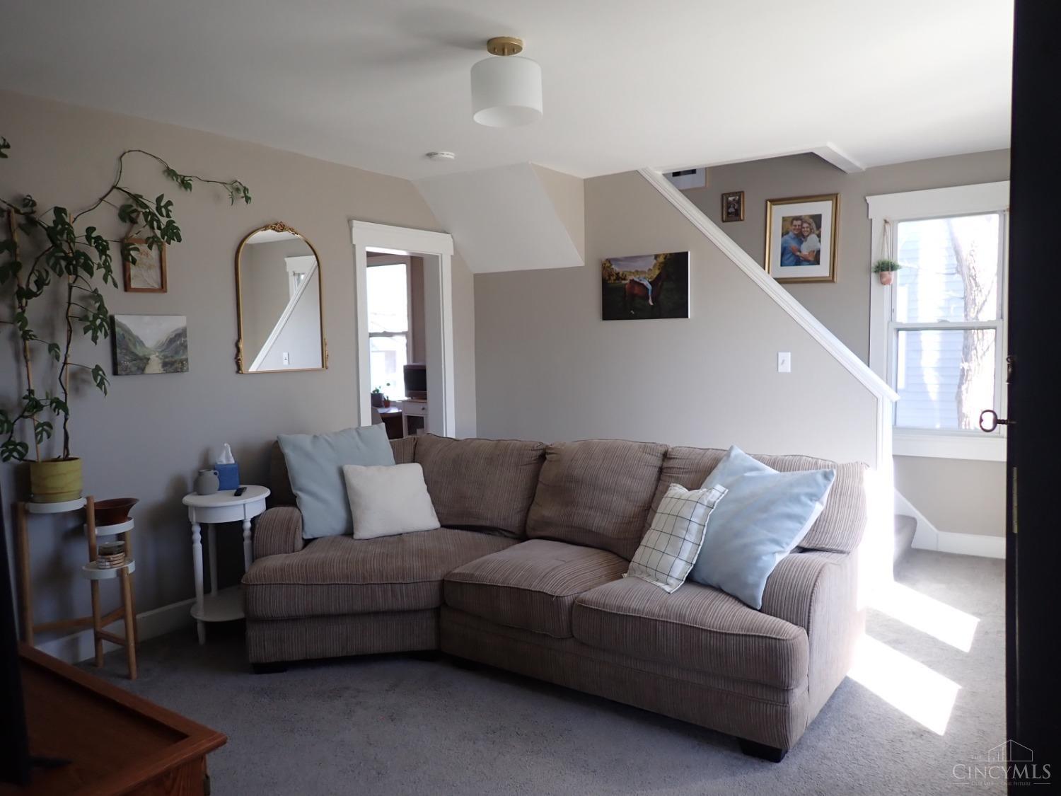 Living Room with lots of natural light, overhead lighting and wall-to-wall carpeting.
