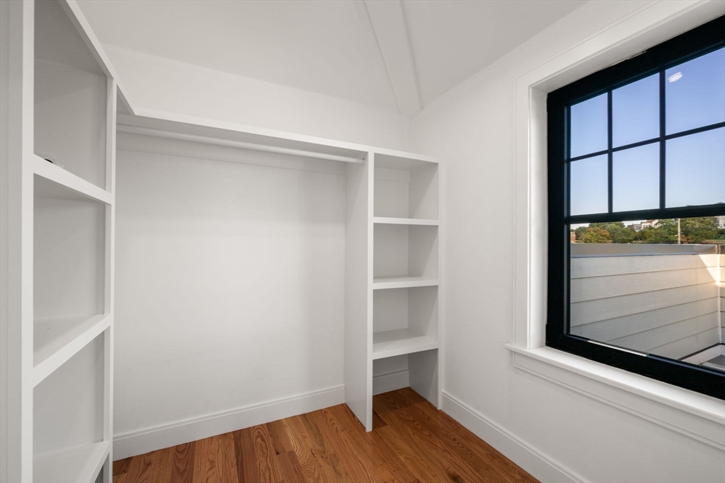 9 Sydney Street, Unit 4 Boston, MA 02125 - Photo 12 of 23 a view of walk in closet with empty racks