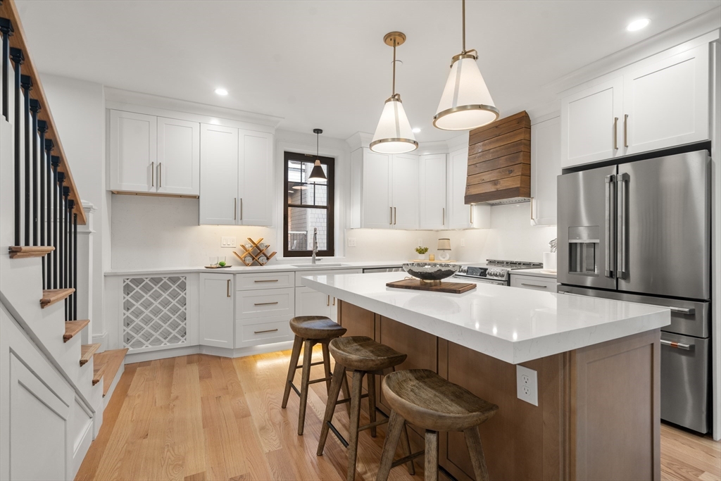 9 Sydney Street, Unit 4 Boston, MA 02125 - Photo 2 of 23 a kitchen with a sink refrigerator and cabinets