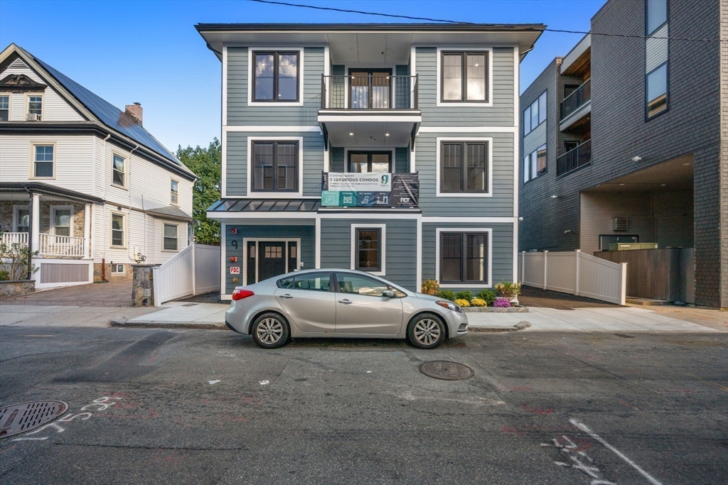 9 Sydney Street, Unit 4 Boston, MA 02125 - Photo 23 of 23 a car parked in front of a building