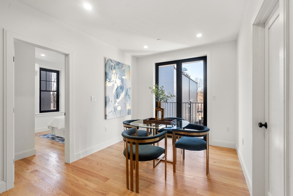 9 Sydney Street, Unit 4 Boston, MA 02125 - Photo 6 of 23 a view of a livingroom with furniture window and wooden floor
