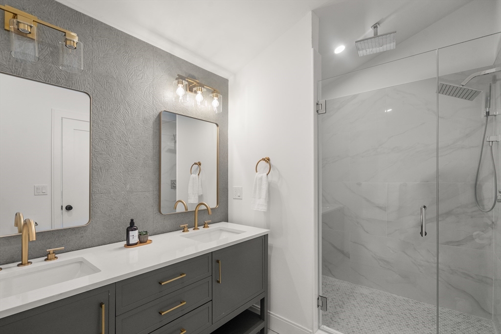 9 Sydney Street, Unit 4 Boston, MA 02125 - Photo 10 of 23 a bathroom with a double vanity sink mirror and double