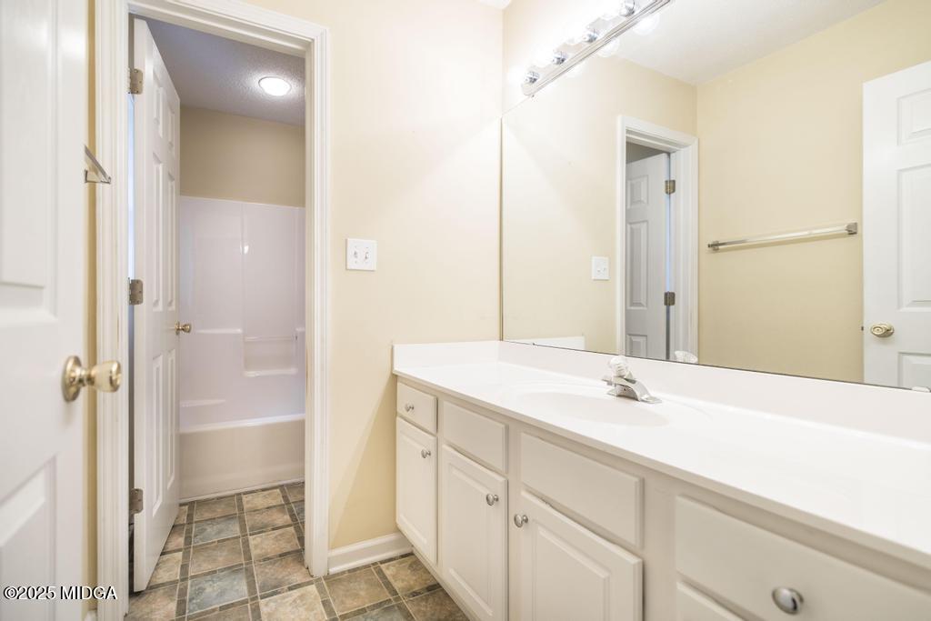 578 Edgefield Way Macon, GA 31210 - Photo 13 of 42 a bathroom with a sink and a mirror